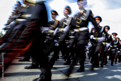 Tableau sur toile young military cadets marching in the square. blurred frame