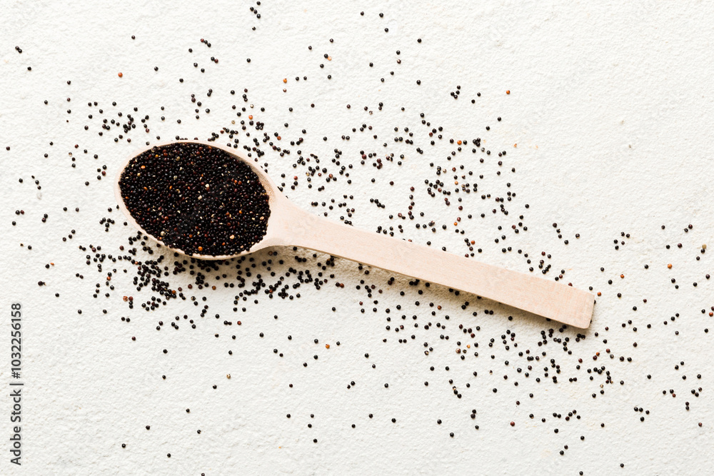 quinoa seeds in spoon on colored background. Healthy kinwa in small spoon. Healthy superfood quinoa seeds in spoon on colored background. Healthy kinwa in small spoon. Healthy superfood