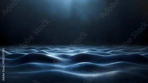 Abstract blue and black waves with a soft light shining from above.