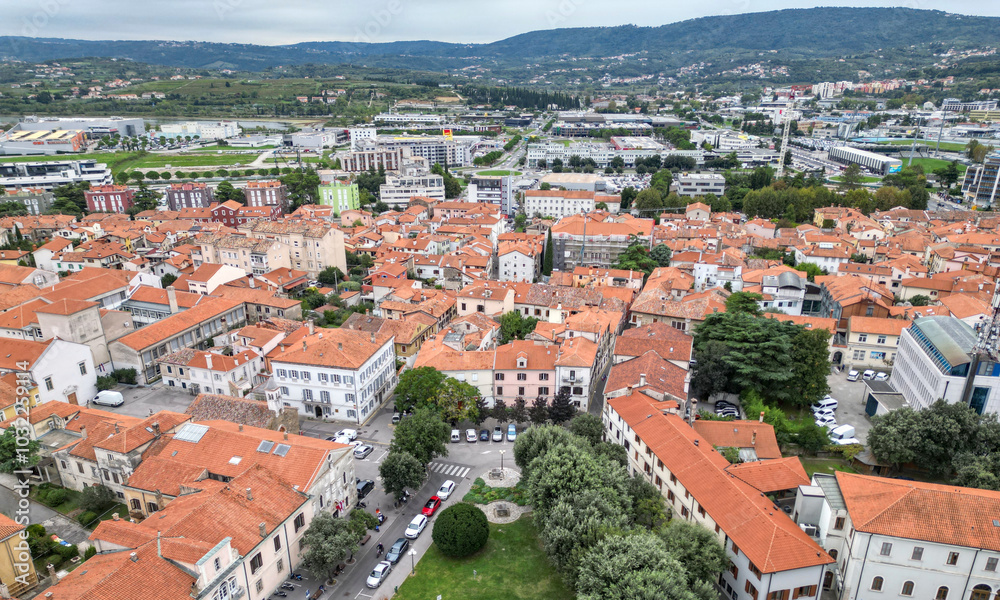 view of downtown koper slovenia (red roof buildings) scenic adriatic coast town streets square city center coastline europe european mediterranean sea mountains balkans venetian view of downtown koper slovenia (red roof buildings) scenic adriatic coast town streets square city center coastline europe european mediterranean sea mountains balkans venetian