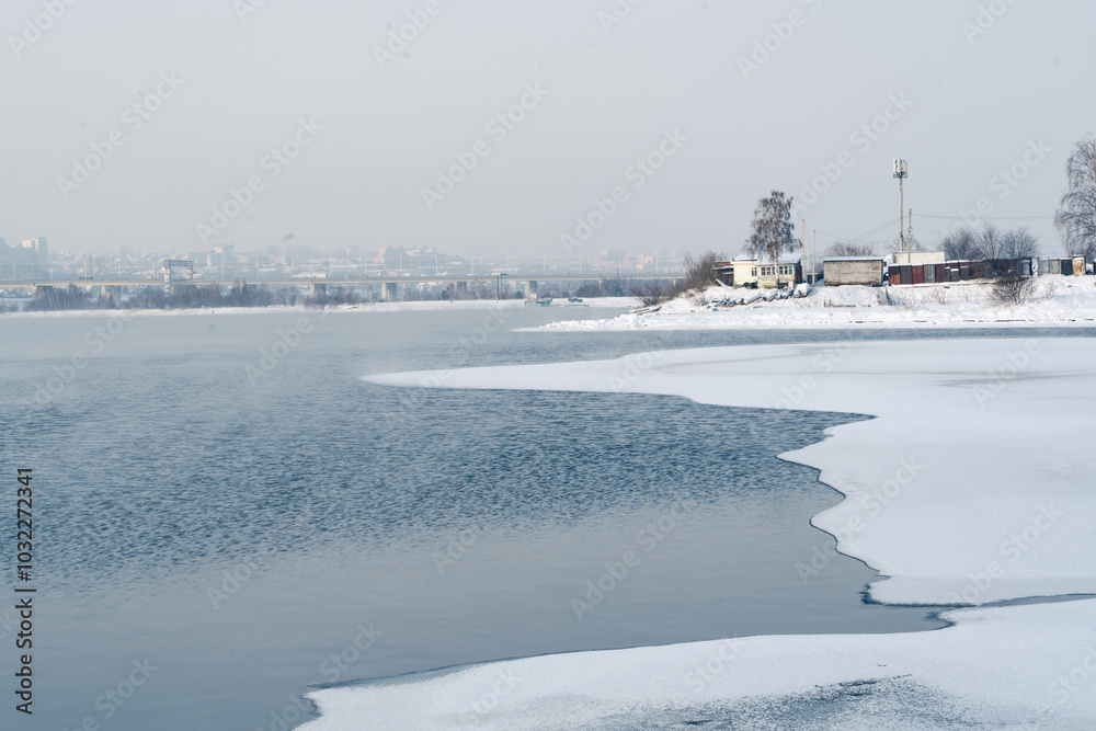 Winter frosty evaporation from the river in cold weather. Winter frosty evaporation from the river in cold weather.