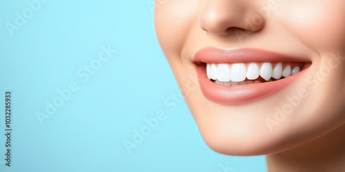 Close-up of a woman's healthy white teeth and radiant smile, contrasted against a softly blurred blue background, emphasizing beauty, dental care, and self-assurance.