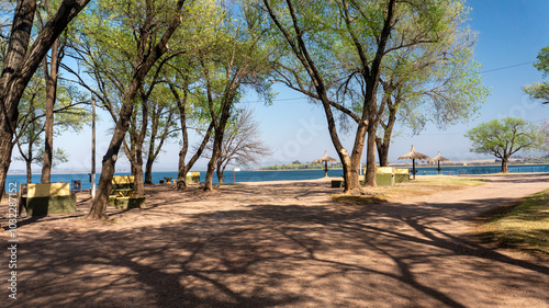 warm spring morning surrrounded by green trees in Villa Rumipal public beach photo