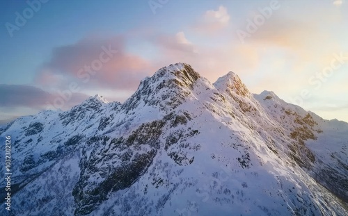 In the morning at Senja Island, a majestic snow mountain with a footprint on Segla hill can be seen