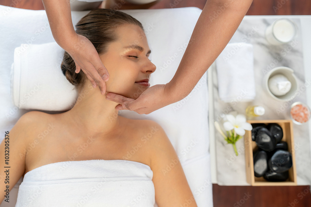 Panorama top view of woman enjoying relaxing anti-stress head massage and pampering facial beauty skin recreation leisure in dayspa modern light ambient at luxury resort or hotel spa salon. Quiescent Panorama top view of woman enjoying relaxing anti-stress head massage and pampering facial beauty skin recreation leisure in dayspa modern light ambient at luxury resort or hotel spa salon. Quiescent