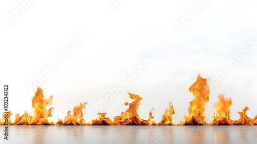 Tall dramatic fire flames reaching upward with bright yellow and red glowing tones against a bold white background creating a striking and fiery visual effect photo