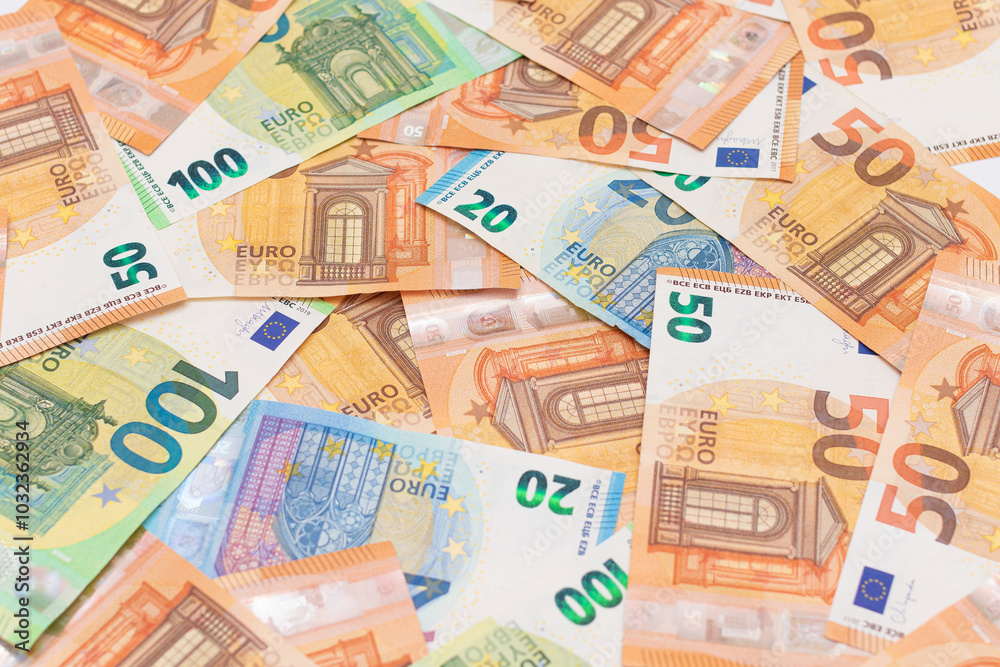 Different Euro Banknotes Money Background. Euro Money Currency. Colored Paper Money. A Lot of Fifty Euro Bills. Business, Finances, Cash and Money Saving Concept Different Euro Banknotes Money Background. Euro Money Currency. Colored Paper Money. A Lot of Fifty Euro Bills. Business, Finances, Cash and Money Saving Concept