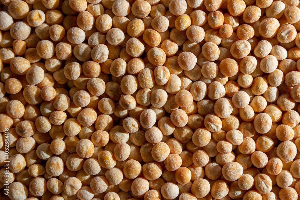 Uncooked Yellow Polished Peas Background. A Culinary Canvas of Dry Yellow Peas, Creating a Lively and Textured Background for Gourmet Cooking. Scattered Raw Polished Peas. Healthy Eating Ingredients Uncooked Yellow Polished Peas Background. A Culinary Canvas of Dry Yellow Peas, Creating a Lively and Textured Background for Gourmet Cooking. Scattered Raw Polished Peas. Healthy Eating Ingredients