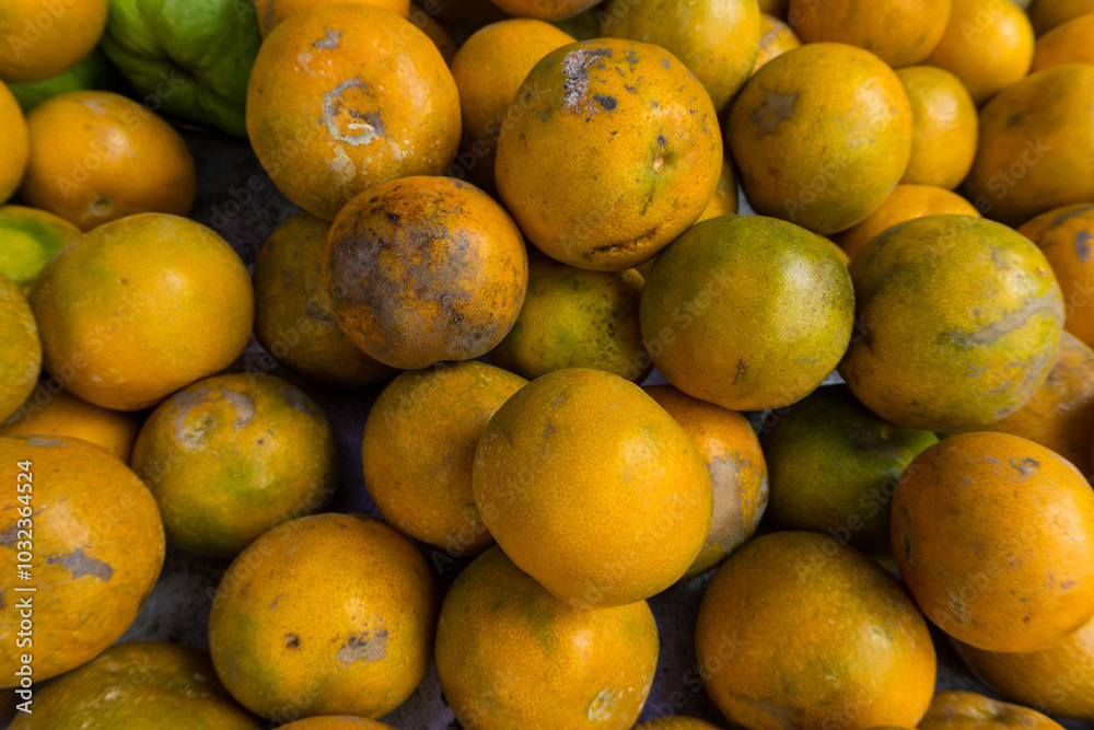a pile of oranges in the traditional market. a pile of oranges in the traditional market.