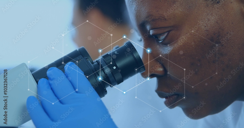 © vectorfusionart - Image of network of connections over african american female scientist working in lab