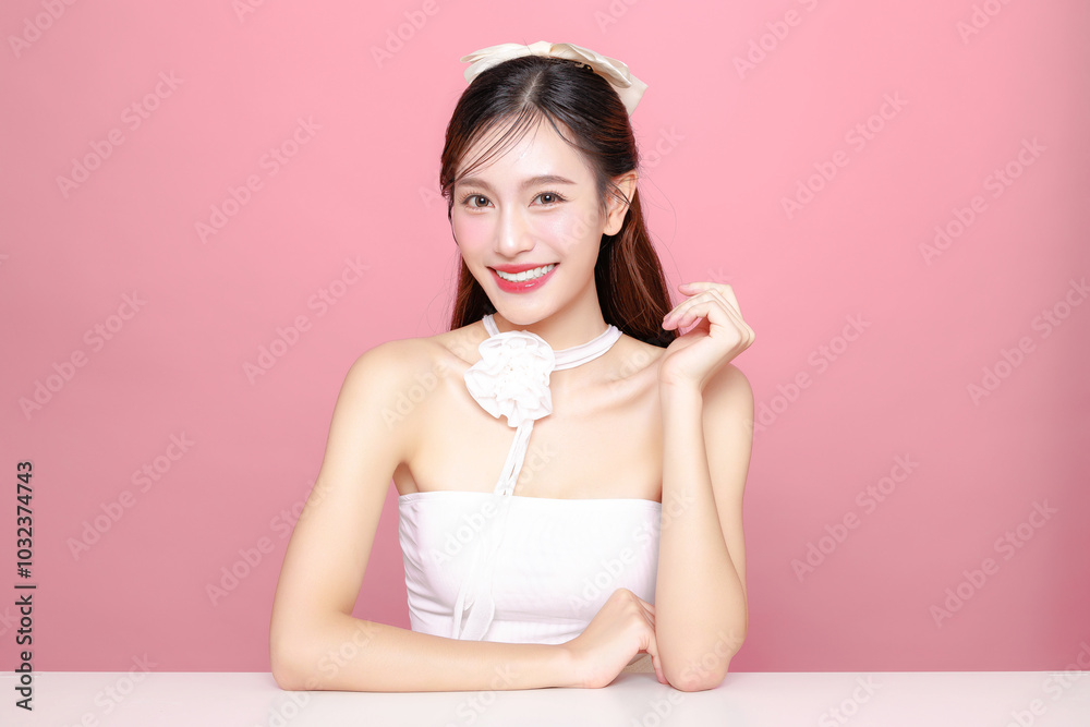Pretty Asian woman model long hair perfect clear fresh skin smile on isolated pink background. Portrait elegant female beauty blogger make up artist in studio. Skincare, plastic surgery, spa concept. Pretty Asian woman model long hair perfect clear fresh skin smile on isolated pink background. Portrait elegant female beauty blogger make up artist in studio. Skincare, plastic surgery, spa concept.