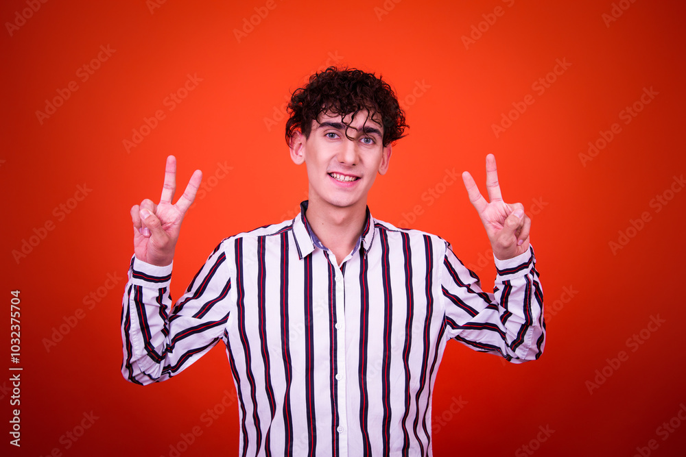 Funny young man posing in studio. Funny young man posing in studio.