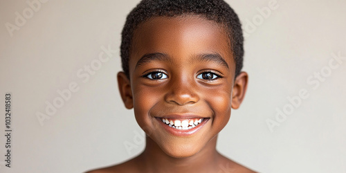 Black teenager boy on a studio background