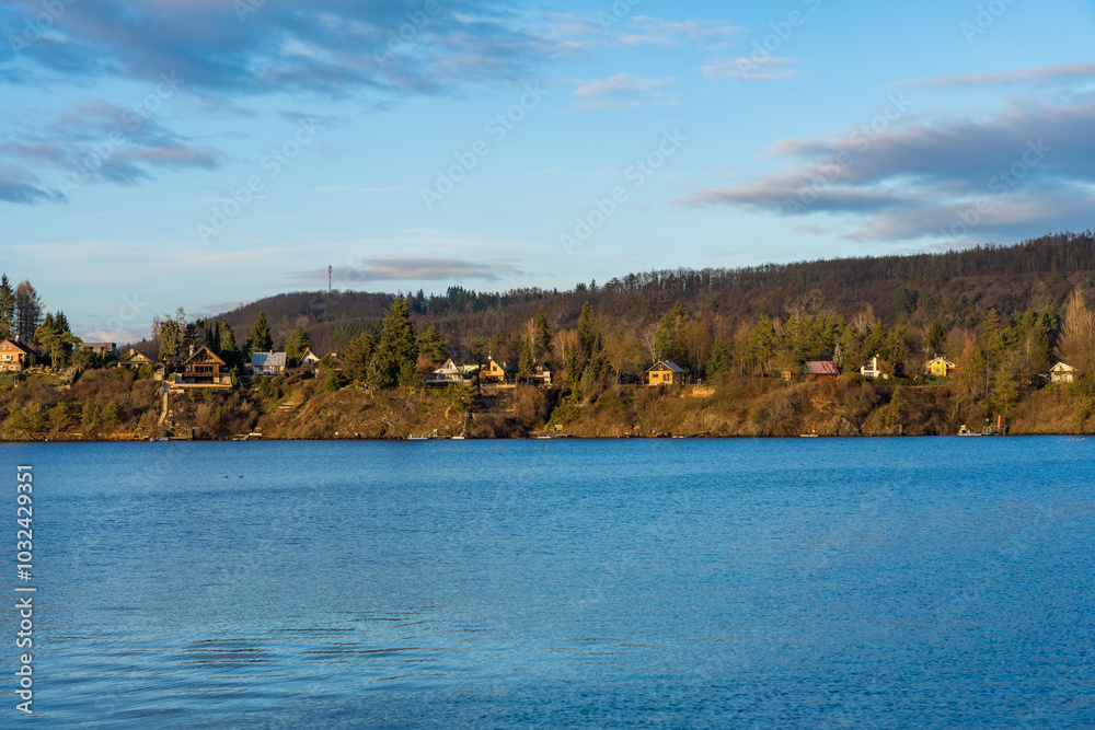 Water level shooting view of Zivohost village and Vltava river under a blue sky, Czech Republic Water level shooting view of Zivohost village and Vltava river under a blue sky, Czech Republic