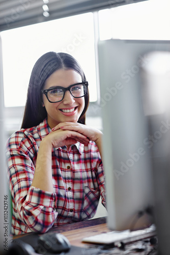 Business woman, portrait and computer in office for research, communication and networking with smile. Graphic designer, happy and pc with infographics for website branding, logo design or typography