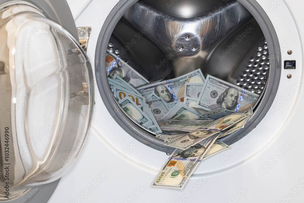 US dollar banknotes in washing machine US dollar banknotes in washing machine