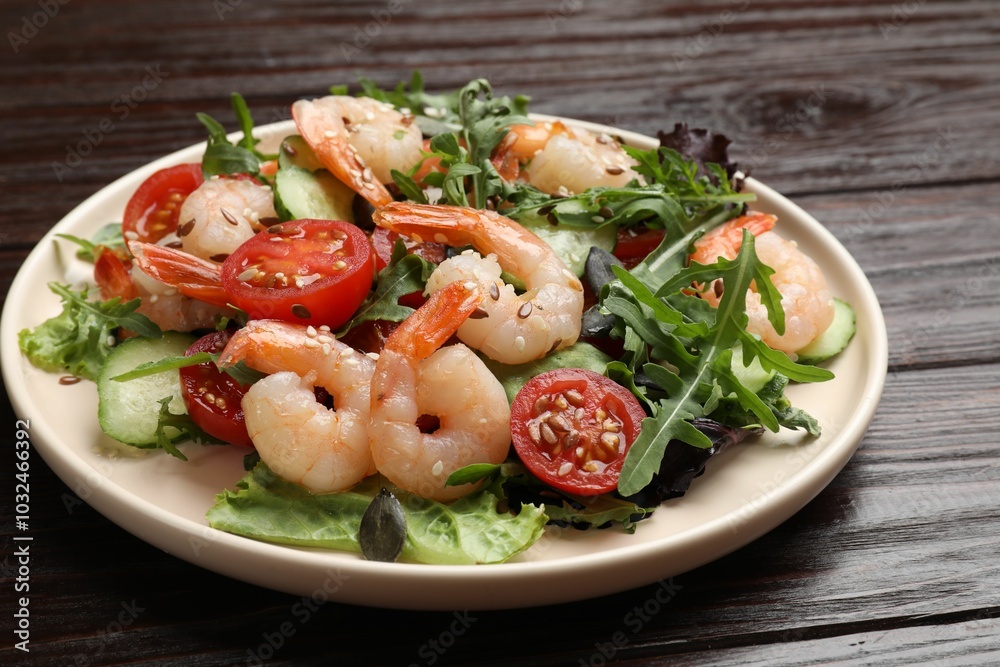 Delicious shrimp salad with vegetables on wooden table, closeup Delicious shrimp salad with vegetables on wooden table, closeup