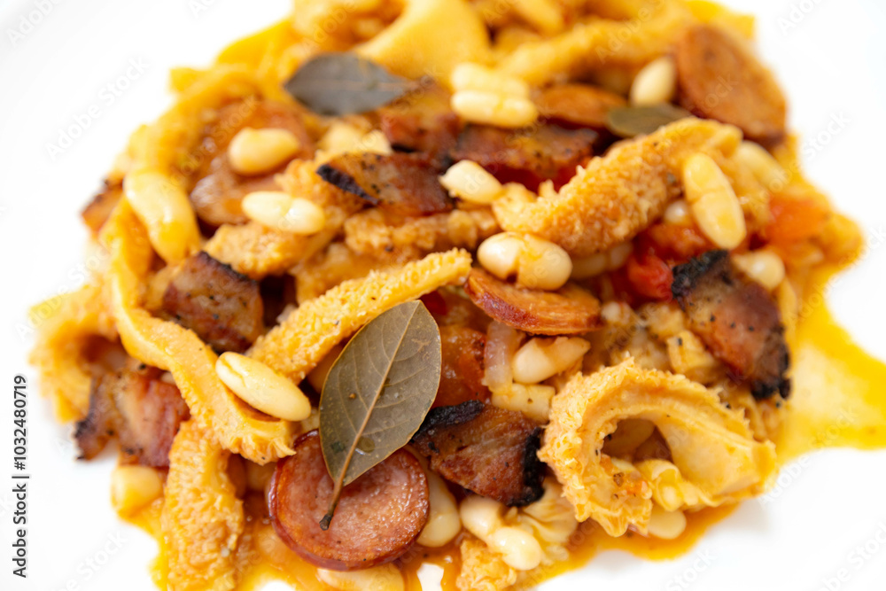 Beef tripe (bucho), beef stomach, tripe on a white plate. Dobradinha