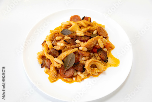 Beef tripe (bucho), beef stomach, tripe on a white plate. Dobradinha