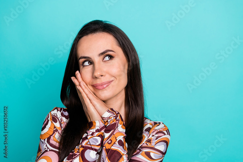Photo of dreamy pretty lady dressed retro shirt arms cheek looking empty space isolated blue color background