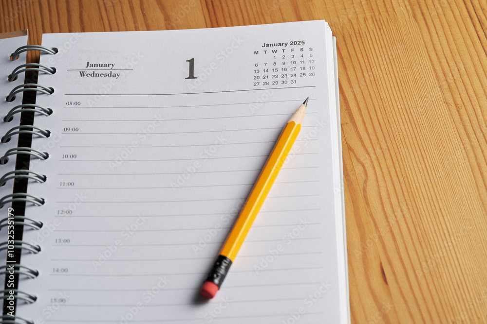 2025 diary on page of January with yellow pencil 2025 diary on page of January with yellow pencil