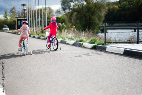 Wallpaper Mural Two young children riding bicycles on a sunny autumn day Torontodigital.ca