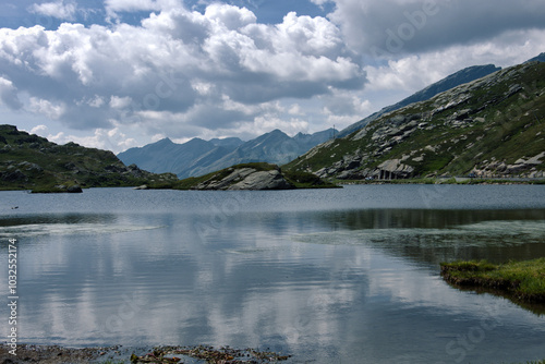 Berhnardinpass. beautiful lake over the Sanbernadino Pass, alps, mountains, blue water and clouds