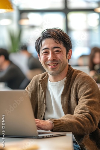 Man Sitting in Bright Space with Laptop