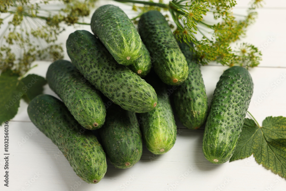 Fresh green cucumbers and spices on white wooden table Fresh green cucumbers and spices on white wooden table