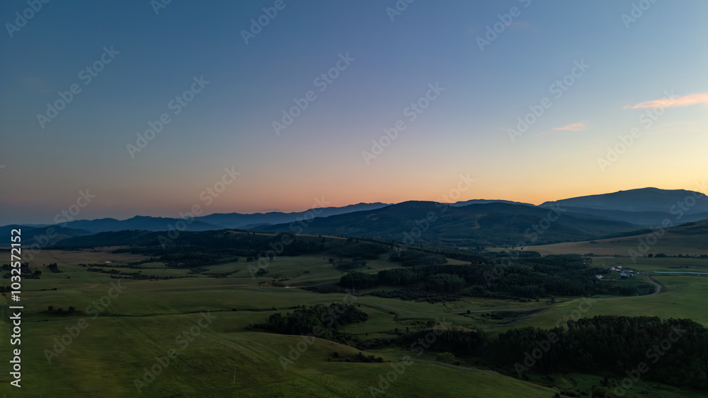 Fototapeta premium Serene Sunset Over Alberta's Rolling Countryside Vista