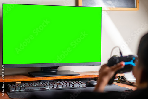 Gamer Playing with Green Screen Monitor