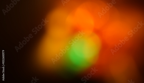 Green orange defocused lights on dark background