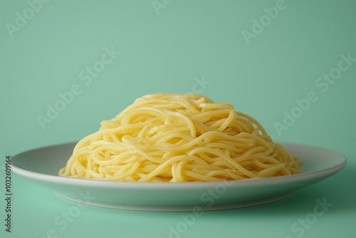 A Mound of Plain Spaghetti on a White Plate