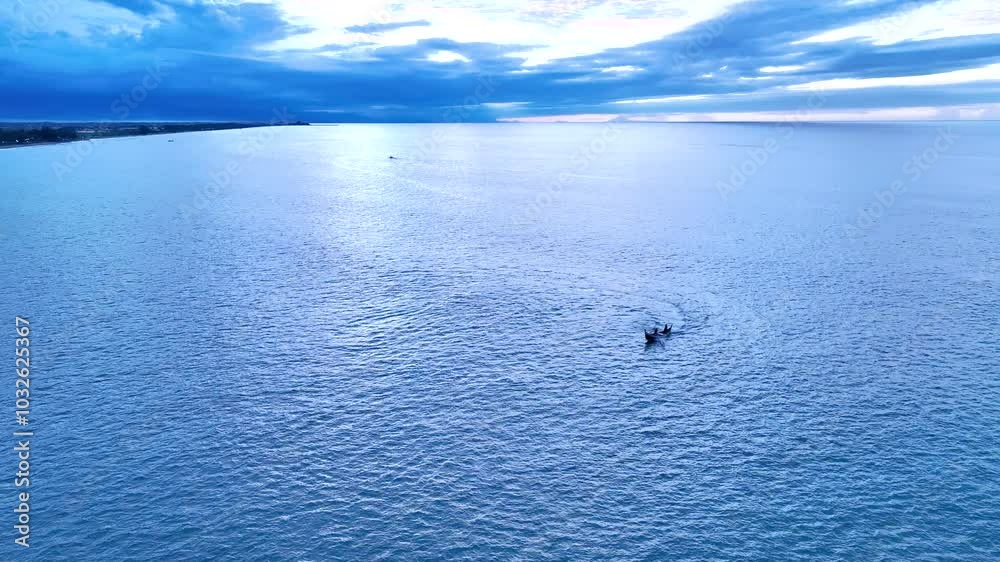 Beautiful of ocean view with clouds and fisherman boat while netting fish Beautiful of ocean view with clouds and fisherman boat while netting fish