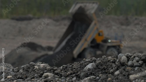 Wallpaper Mural Industrial mining equipment operating at the huge quarry. Industrial mining equipment unloads the collected rocks onto the ground. Industrial mining equipment discharging the stone at the carrier. Torontodigital.ca