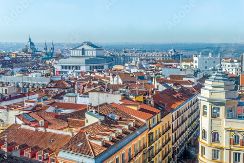 Madrid, Spain - November 30, 2021: Aerial view of Madrid's historic cityscape, showcasing the Royal Palace and the Almudena Cathedral. Panoramic shot highlights the city vibrant architectural beauty