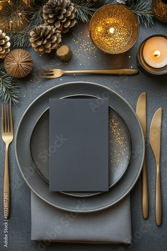 Elegant dinner table setting with gold accents and festive decor for a winter...