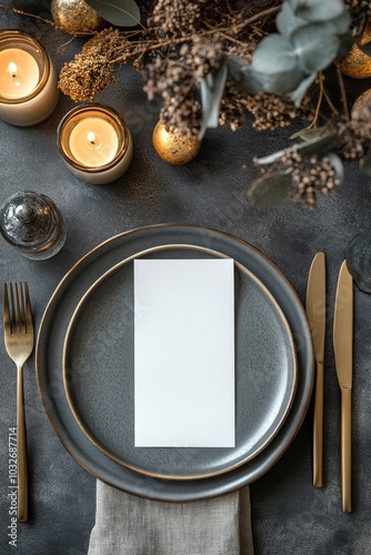 Elegant dinner table setting with gold accents and festive decor for a winter...