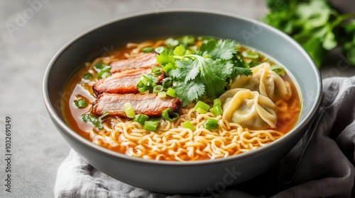 A bowl of Thai-style egg noodle soup with wontons and barbecue pork