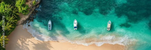 Two boats anchored near a serene beach surrounded by palm trees and crystal c...