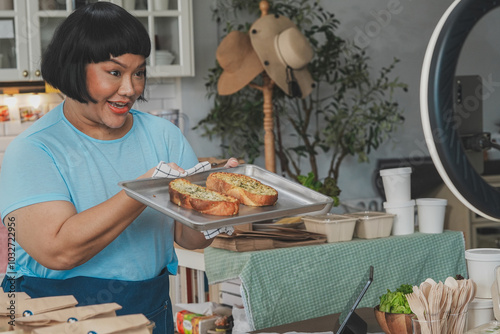 Happy Chef Holding Freshly Baked Bread in a Cozy Kitchen