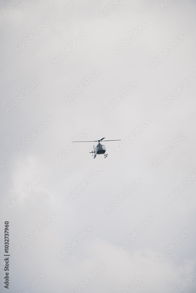 A helicopter is flying in the sky
A helicopter is flying in the sky