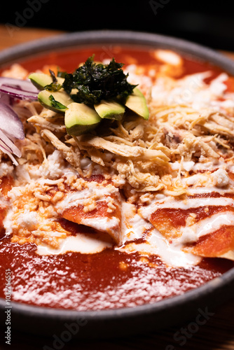Obraz na płótnie Traditional typical Mexican food, Mexican gastronomy concept. Tacos, chilaquiles, Mexican tradition. w salonie