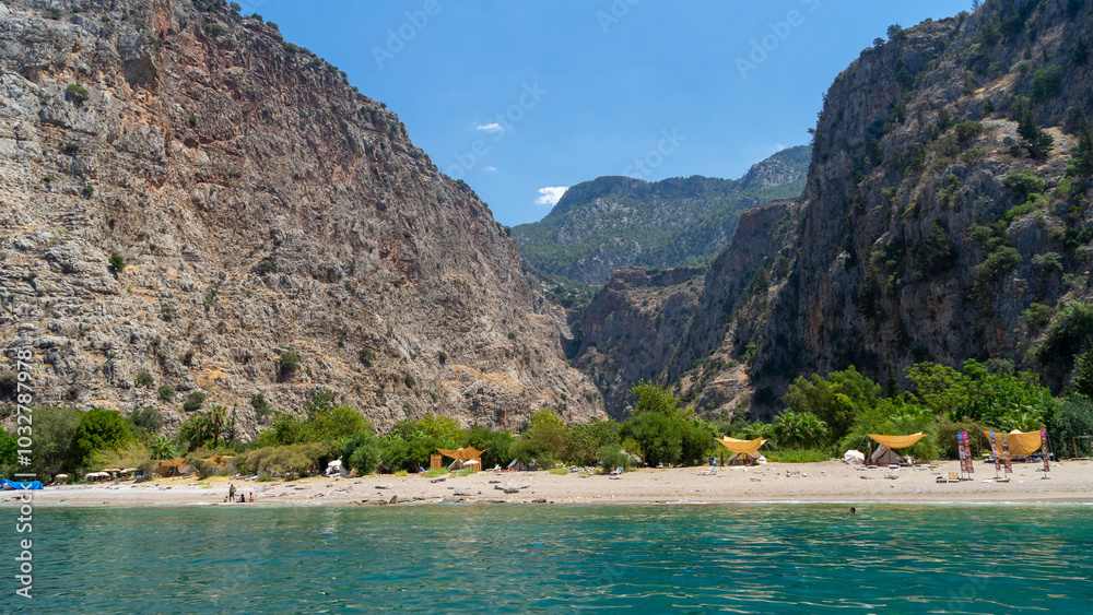 Beach in Butterfly Valley, small very picturesque canyon facing Mediterranean Sea, Kelebekler, Oludeniz, Turkey Beach in Butterfly Valley, small very picturesque canyon facing Mediterranean Sea, Kelebekler, Oludeniz, Turkey