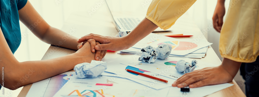 Panorama startup employee holding hand to stressed colleague due to failure, frustrated from no inspiration, lack of idea. Exhausted from overwhelm work and supportive coworker concept. Synergic Panorama startup employee holding hand to stressed colleague due to failure, frustrated from no inspiration, lack of idea. Exhausted from overwhelm work and supportive coworker concept. Synergic