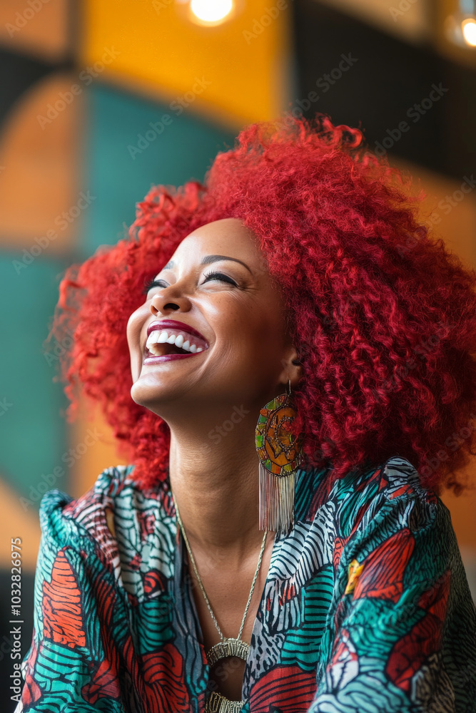 Fototapeta premium A middle-aged Black woman with striking red hair is captured laughing joyfully, her vibrant locks swirling around her in a lively setting. Her laughter is contagious, and her energy radiates in every