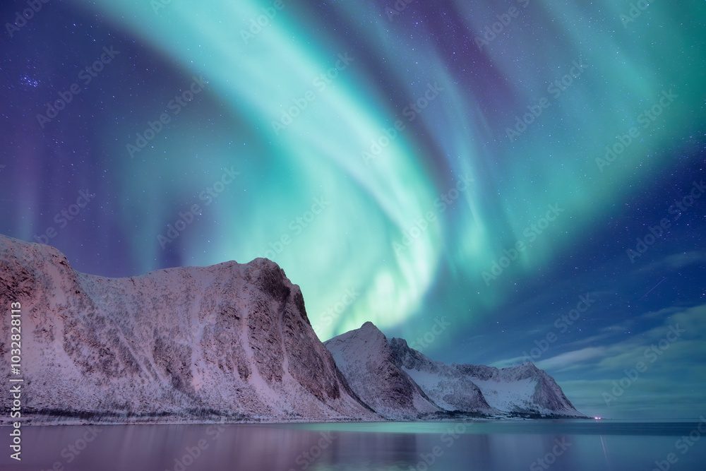 Naklejka premium Northern Lights in Norway, Lofoten Islands. Winter night landscape. Starry sky with polar lights. Aurora Borealis. Natural phenomenon.