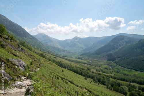 Ben Nevis summit path on the edge of Glen Nevis valley on sunny day photo