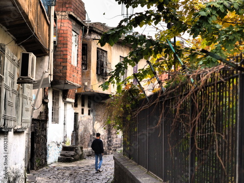 a street road made of natural stones and a view of old houses in diyarbakir turkey