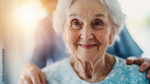   Nursing home residential care concept. Smiling elderly woman with gray hair, warm expression, healthcare setting.